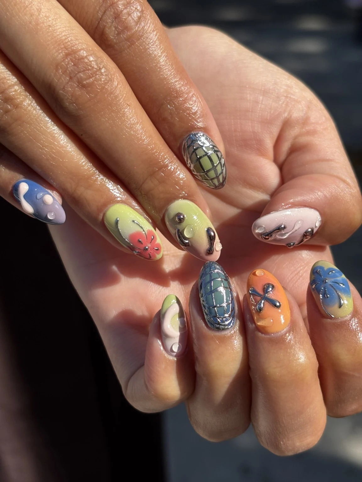Colorful sculpted nail art from a Takumi Japanese Manicure