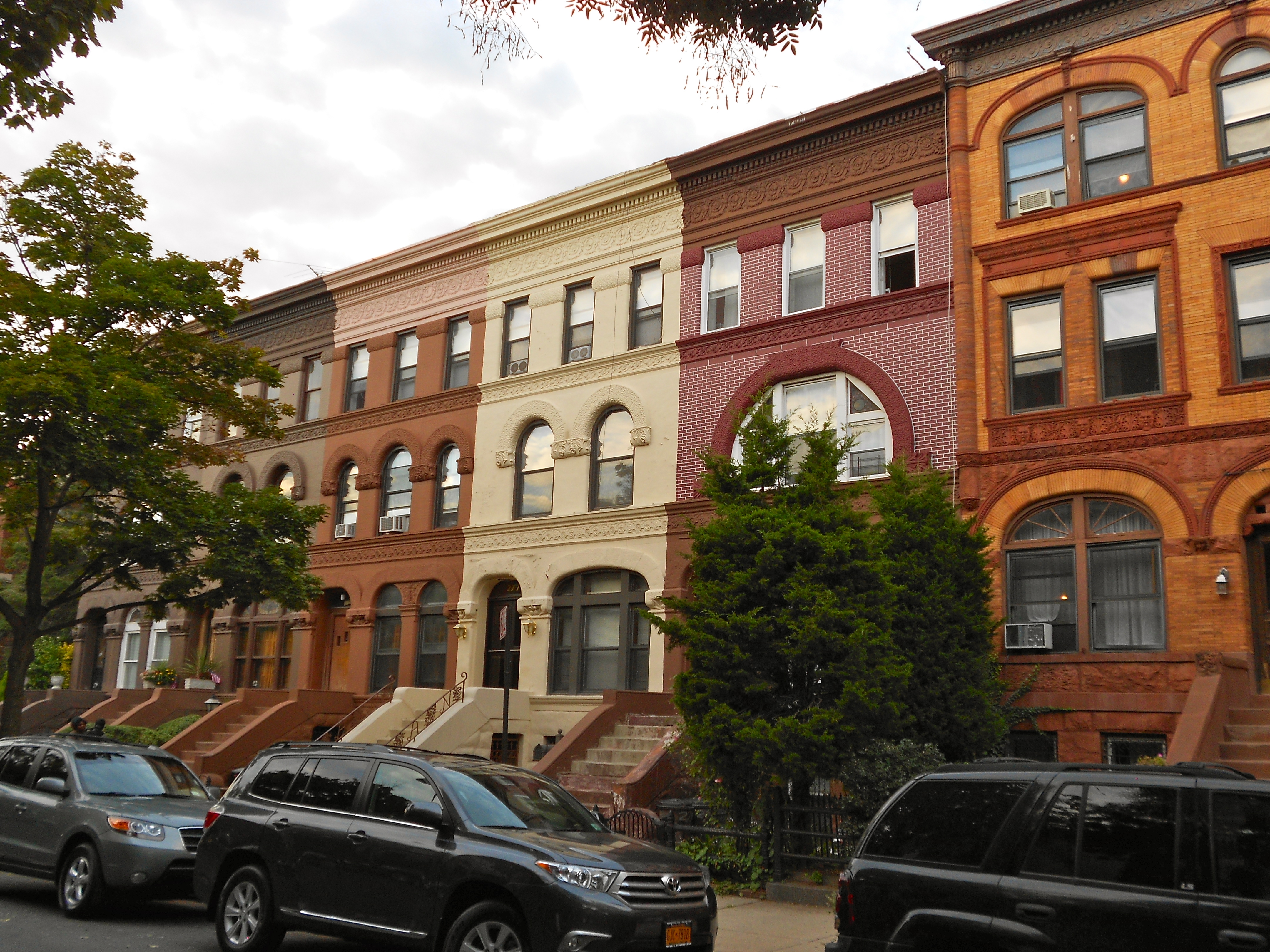 Brick and brownstone row houses on Decatur Street in the Stuyvesant Heights Historic District in Bed Stuy